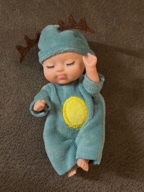 Plush Sleepy Baby Doll in Teal Outfit with Yellow Patch